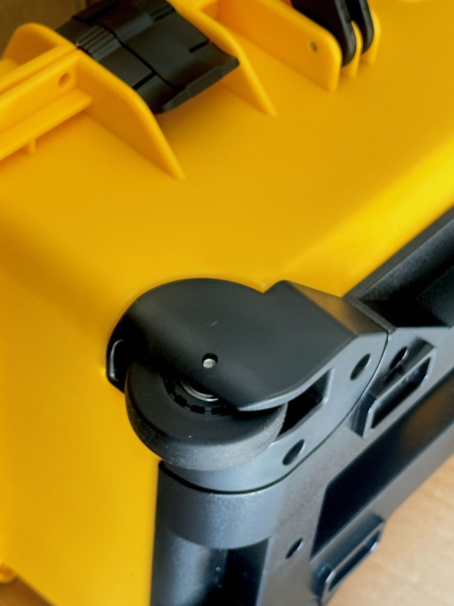Close-up of the wheel and latch on a Yellow case