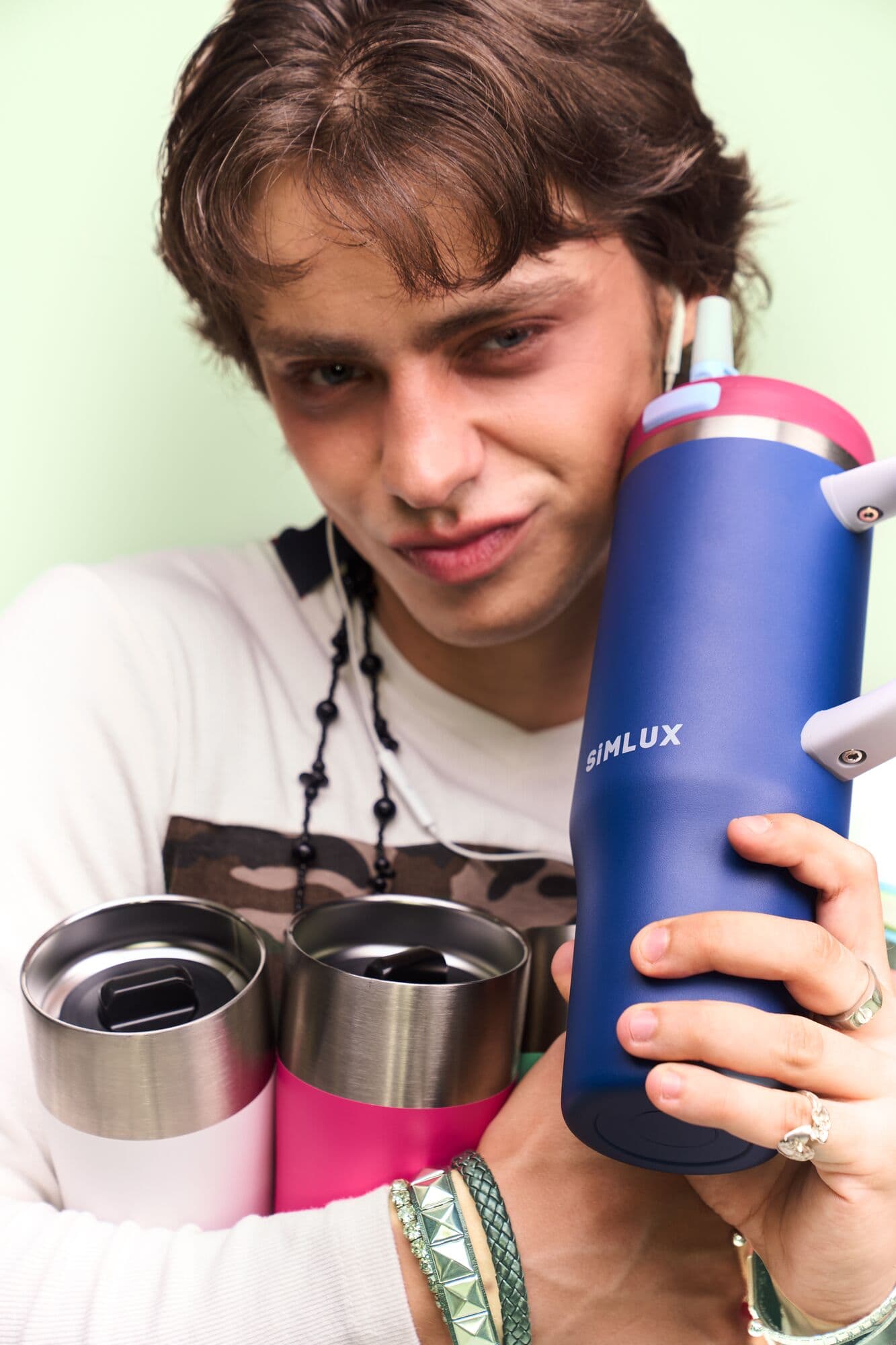 Model with a Deep Blue tumbler and two coffee tumblers