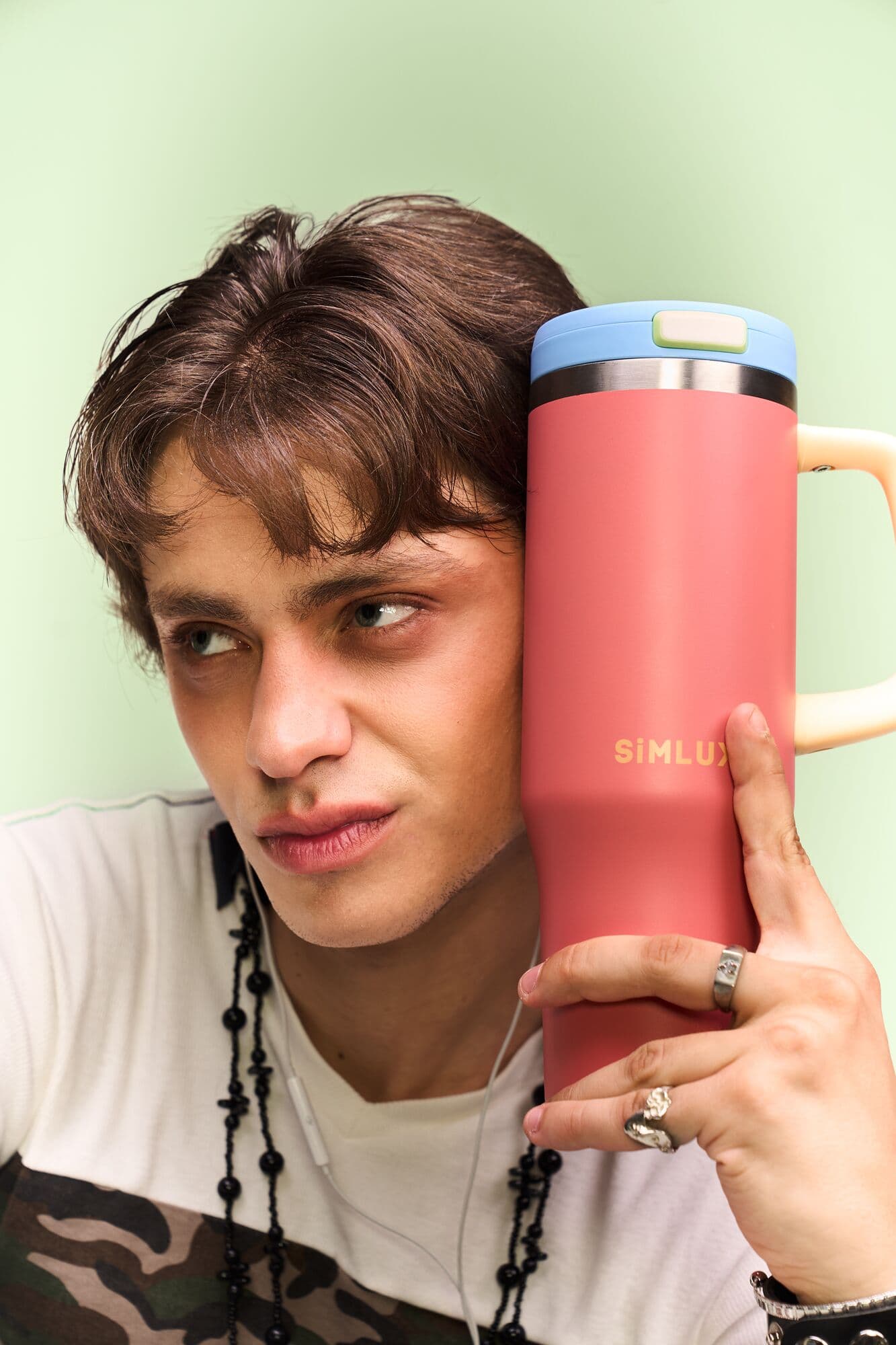 Model dancing with a Candy Pink SiMLUX 40oz tumbler