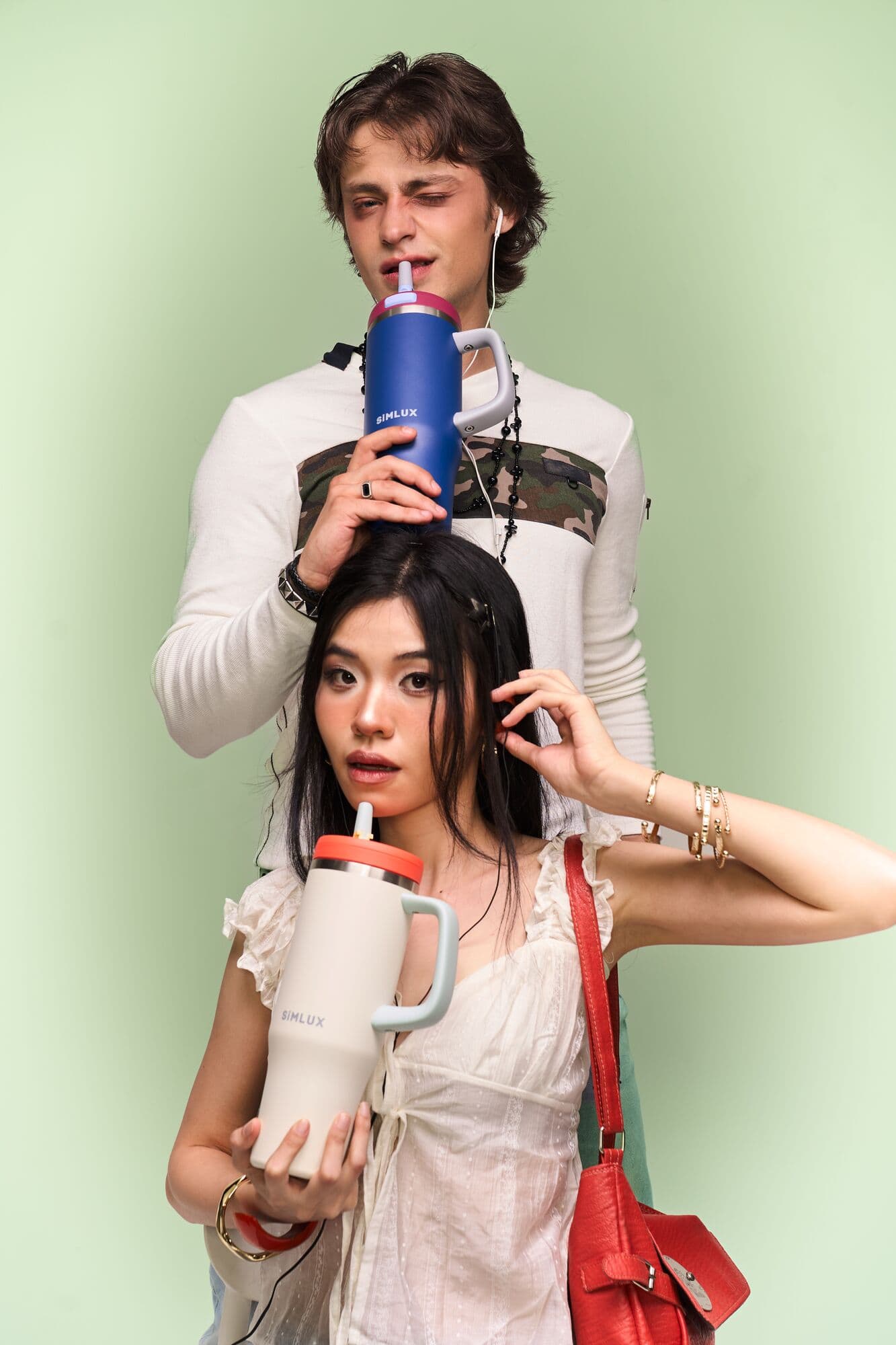 Two models stacked in frame, each with a tumbler