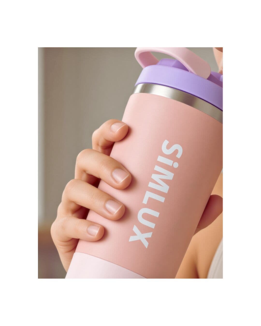 Close-up of a hand around a Pink shaker