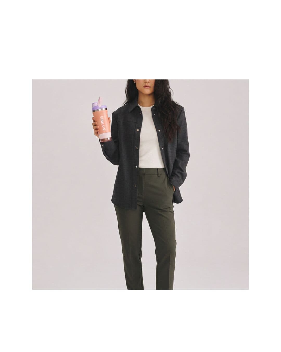 Model in a black jacket carrying a Pink shaker